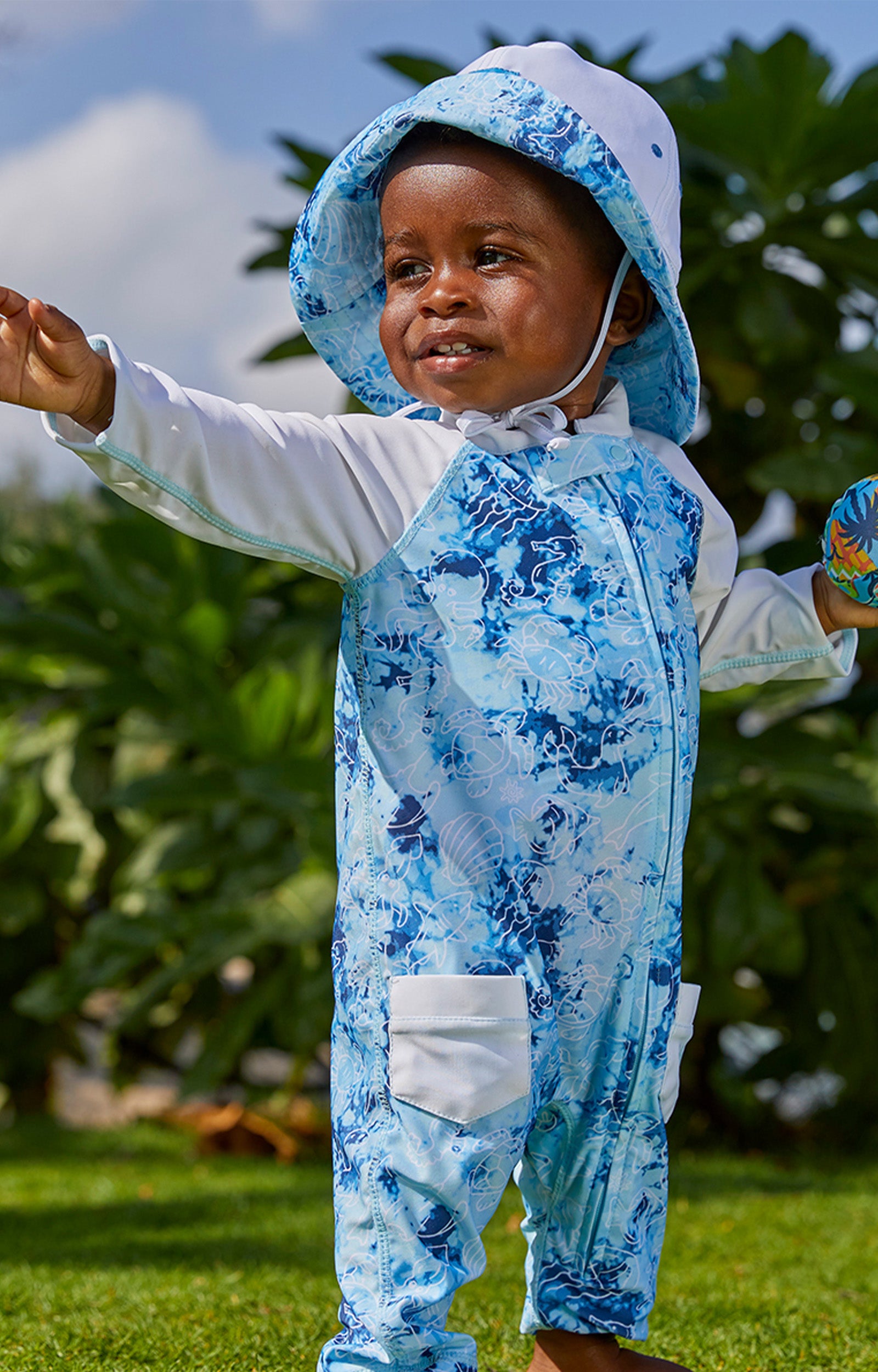 Baby boy in UV Skinz's boy's long-sleeve swimsuit in sea friends|sea-friends