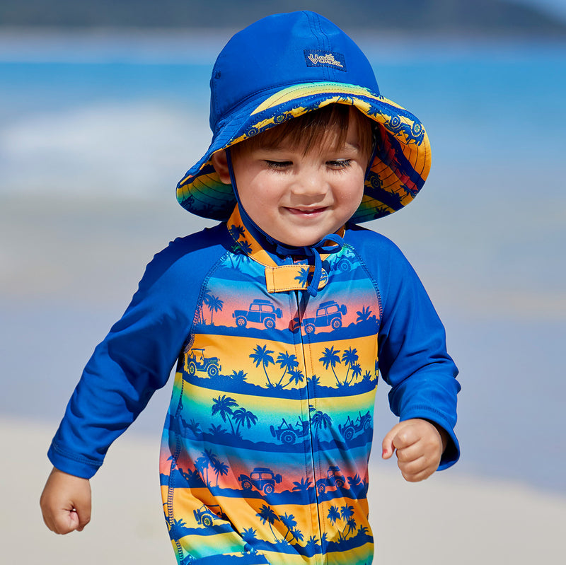 Baby boy wearing UV Skinz's baby boy's sun hat in sunset safari ride|sunset-safari-ride