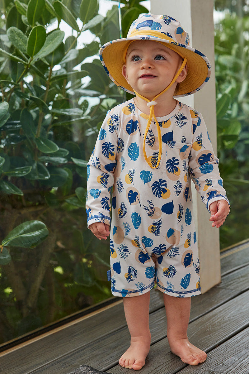 baby boy in swim hat|shadow-leaf
