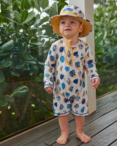 baby boy in swim hat|shadow-leaf
