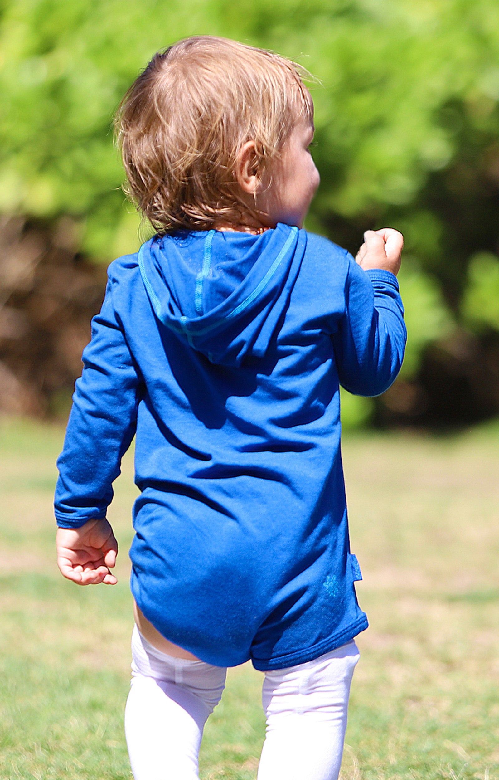 Baby Boy Walking in the Sun Outside in the Yard in the Baby Boy's Hooded Sunzie|navy-blue