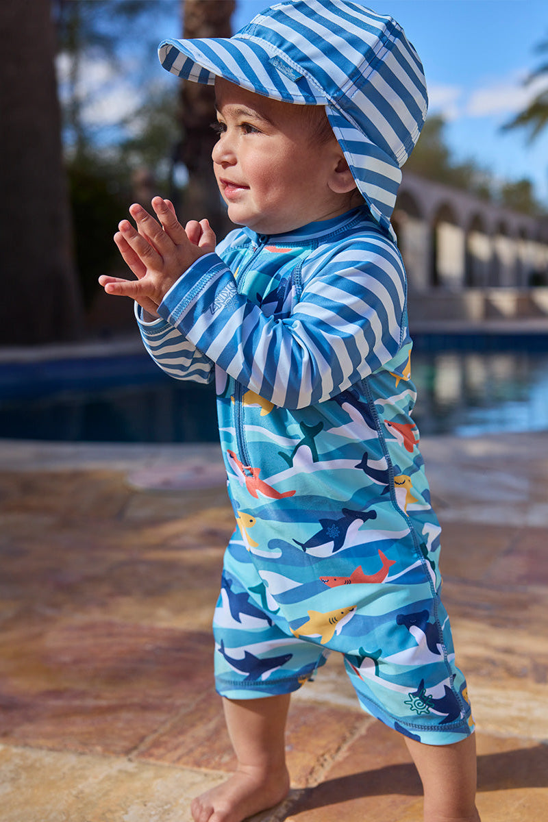 baby boy clapping in long sleeve swim romper|waverider-sharks