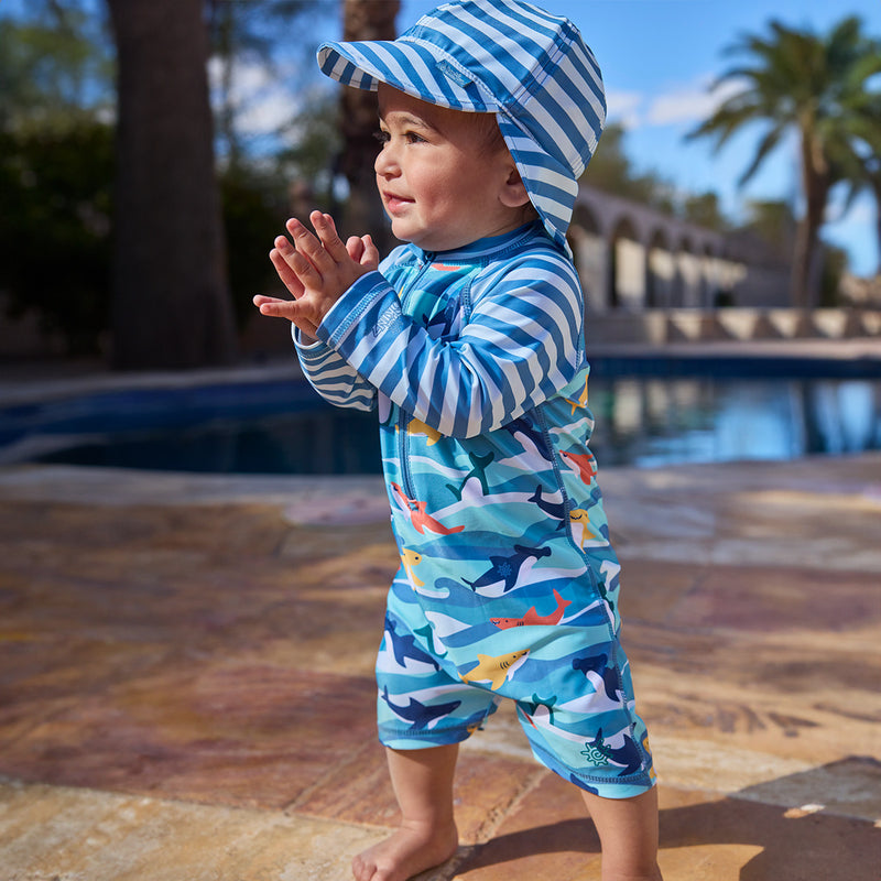 baby boy clapping by pool in swim flap hat|waverider-stripe