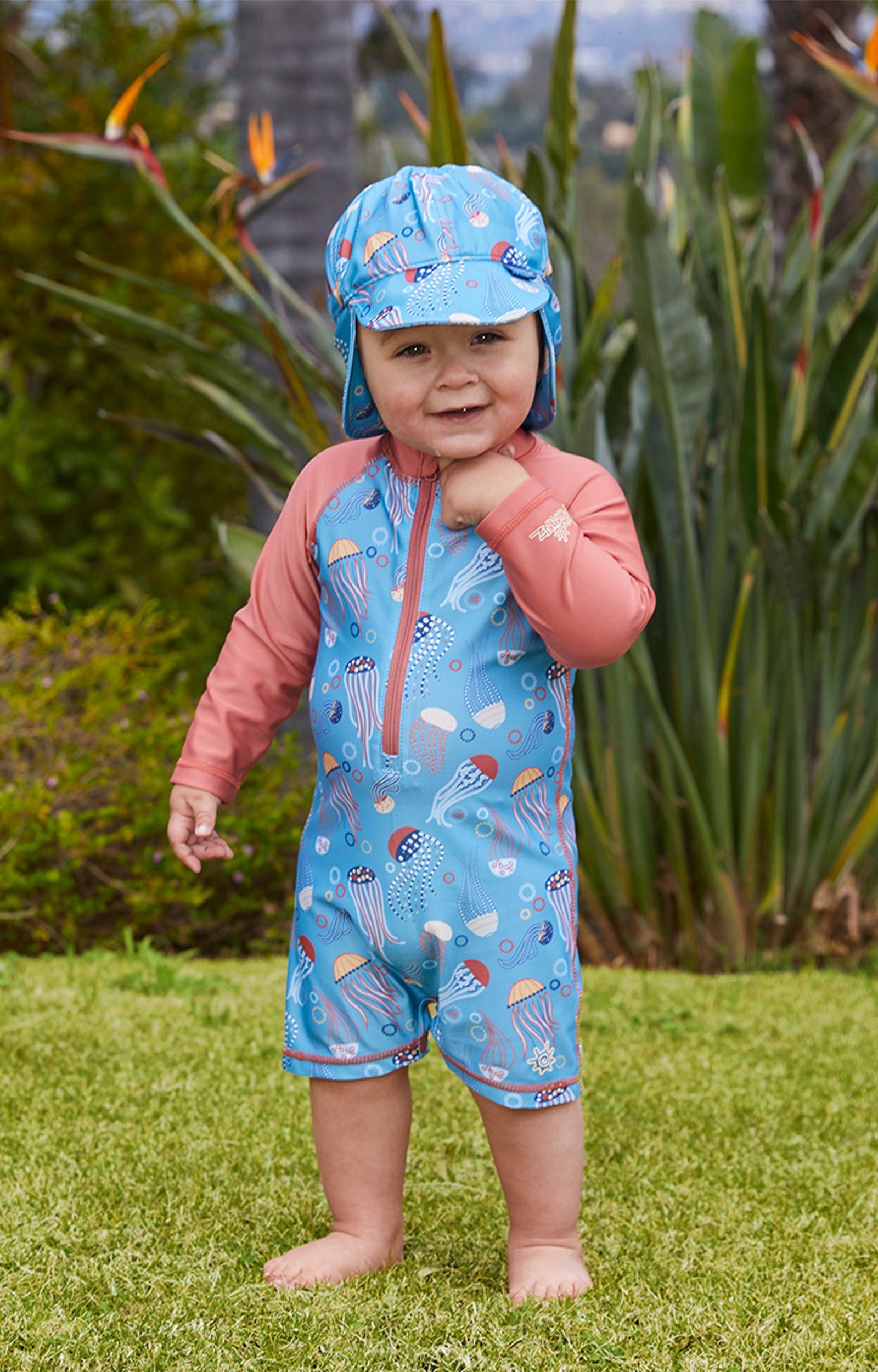 Little boy in UV Skinz's baby boy's long sleeve swimsuit in jolly jellies|jolly-jellies