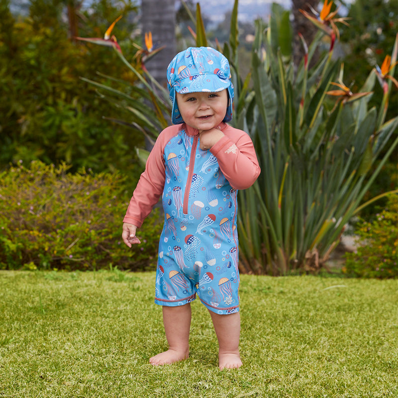 Little boy in UV Skinz's baby boy's long sleeve swimsuit in jolly jellies|jolly-jellies