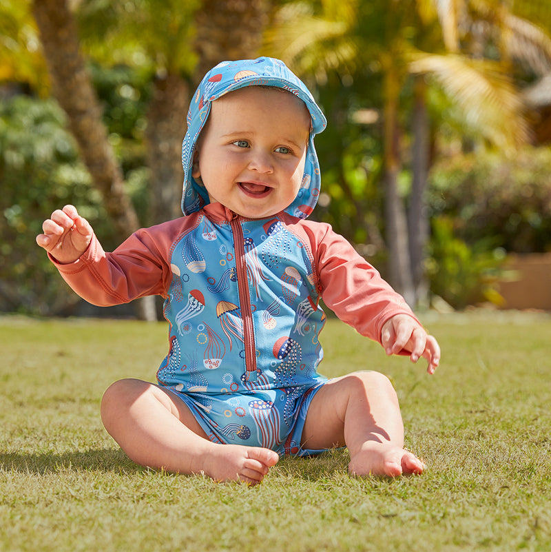 Little boy in UV Skinz's baby boy's long sleeve swimsuit|birdie-stripe