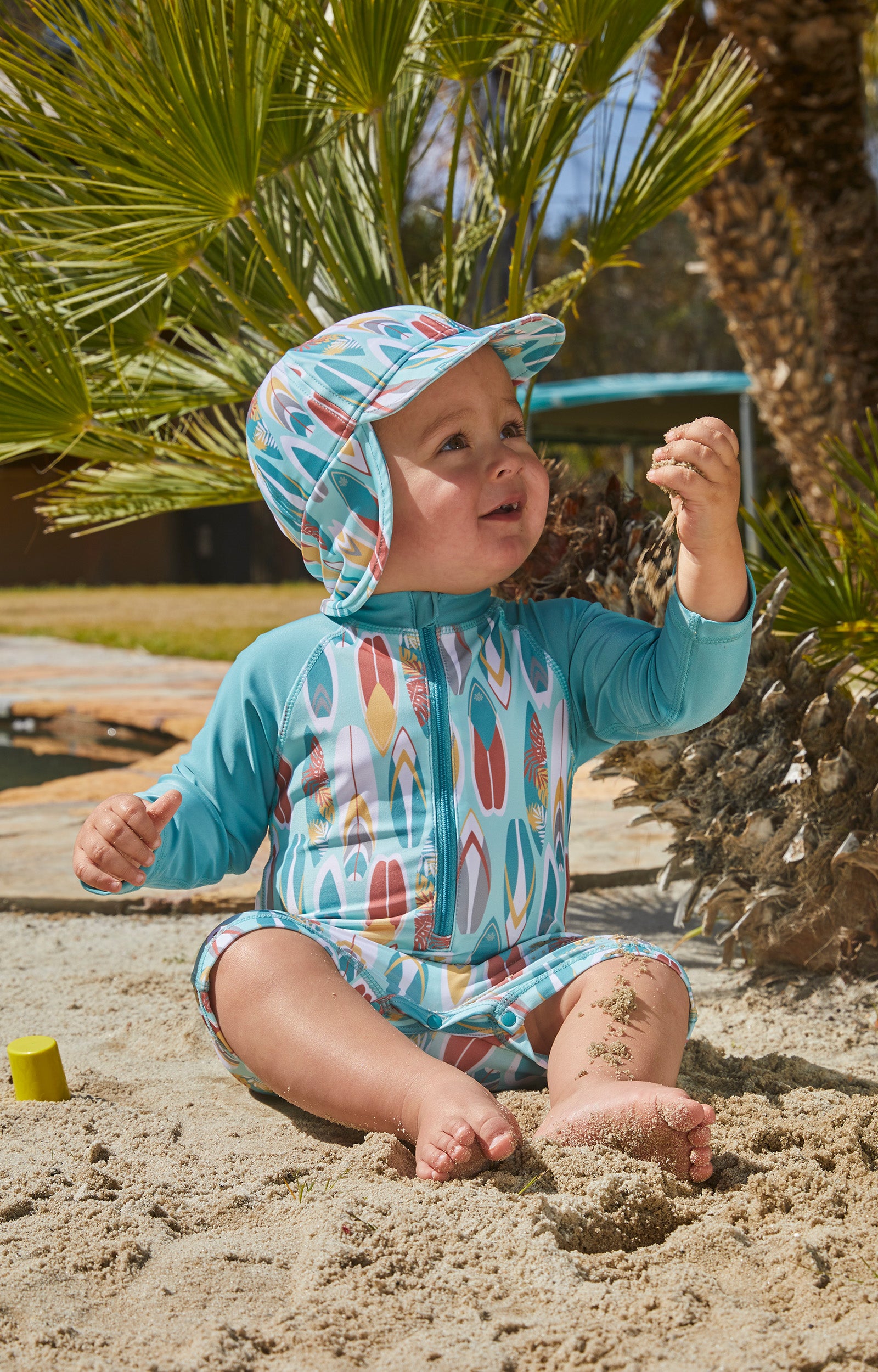 baby in UV Skinz's baby boy's long sleeve swimsuit in surfs up|surfs-up