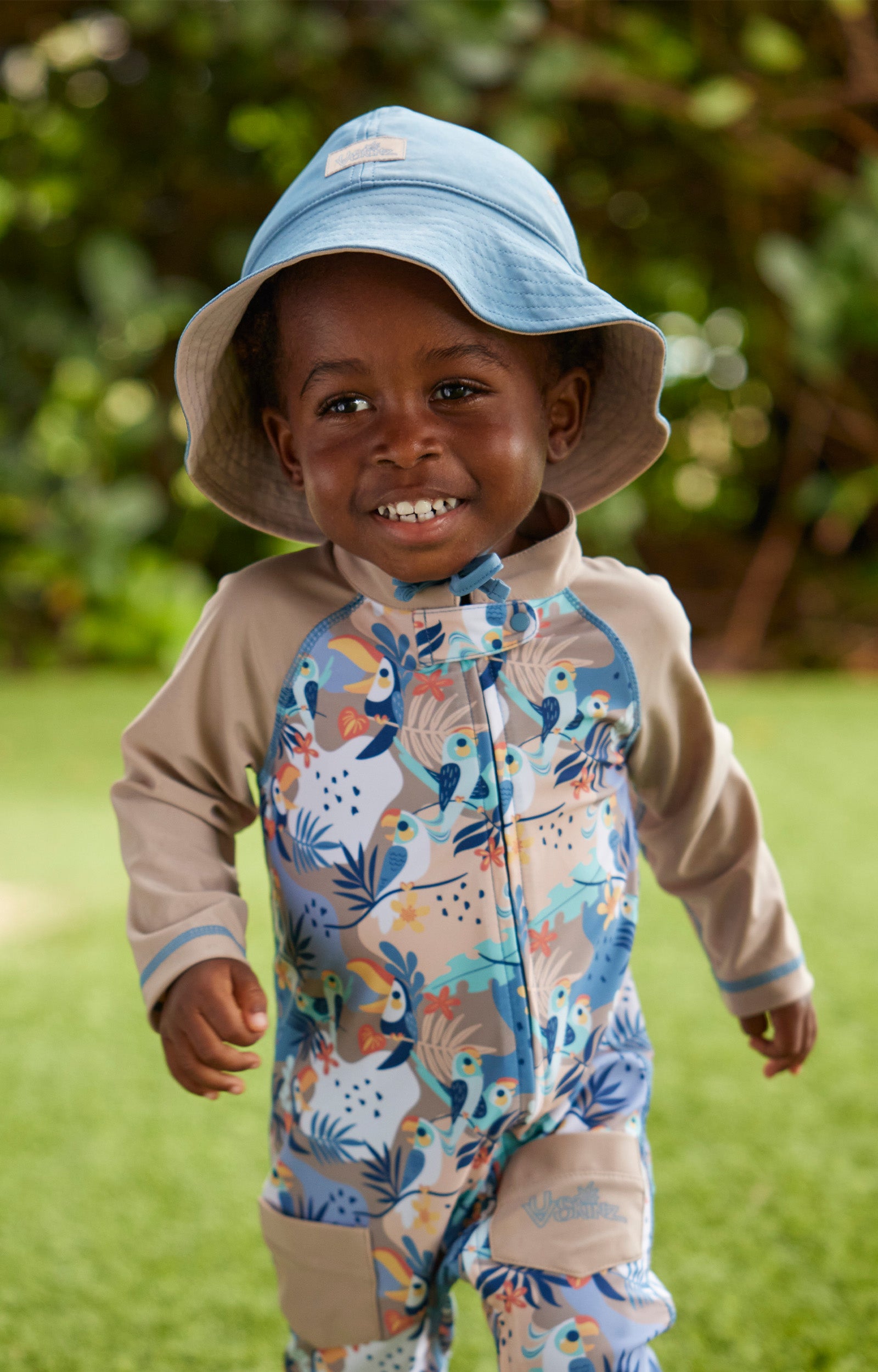 baby boy in reversible sun hat|baltic-sandstone