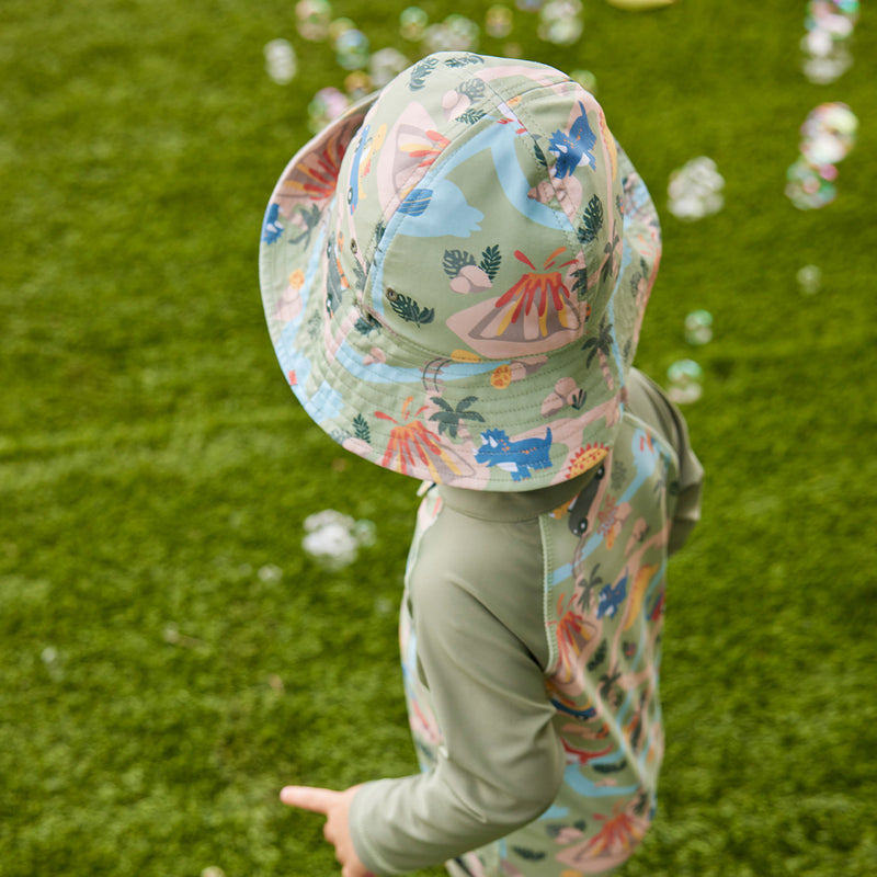 back view of baby boy in reversible sun hat|dinoville