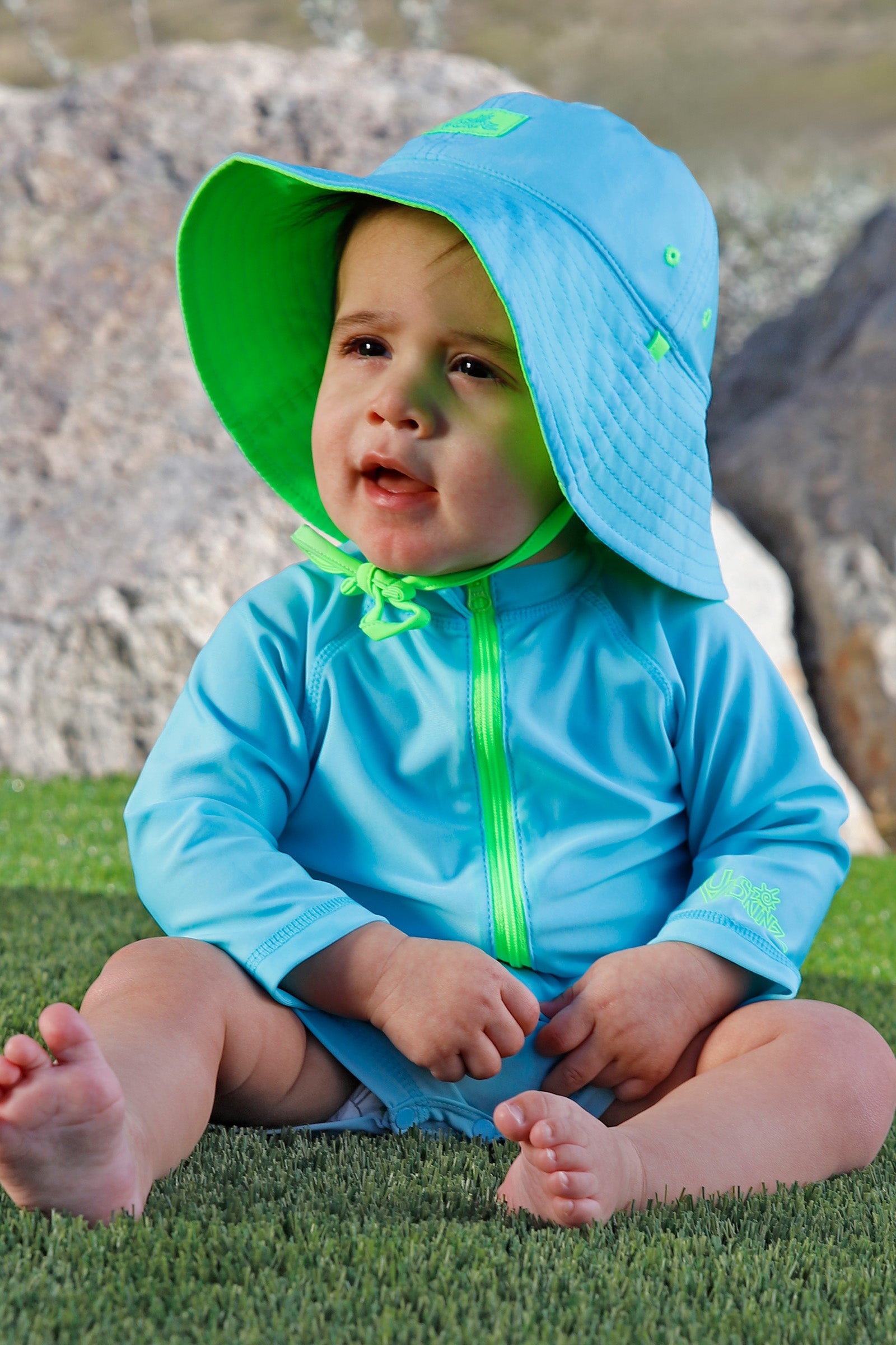 baby in reversible sun hat|neon-sky-neon-green