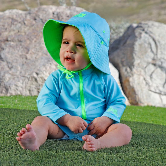 baby in reversible sun hat|neon-sky-neon-green