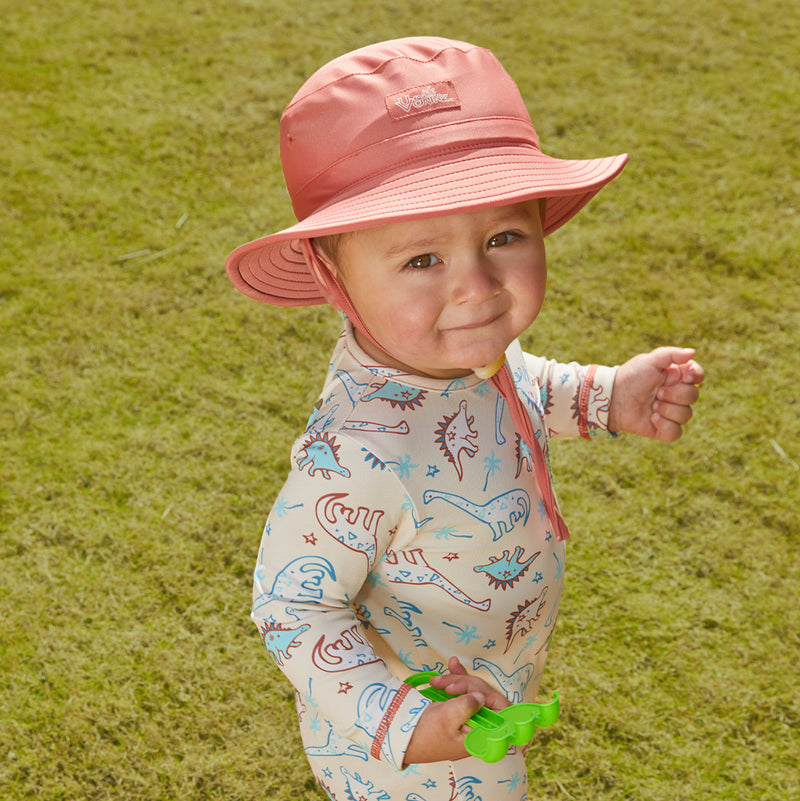 Little baby boy in UV Skinz's baby boy's swim hat in canyon|beach-glass