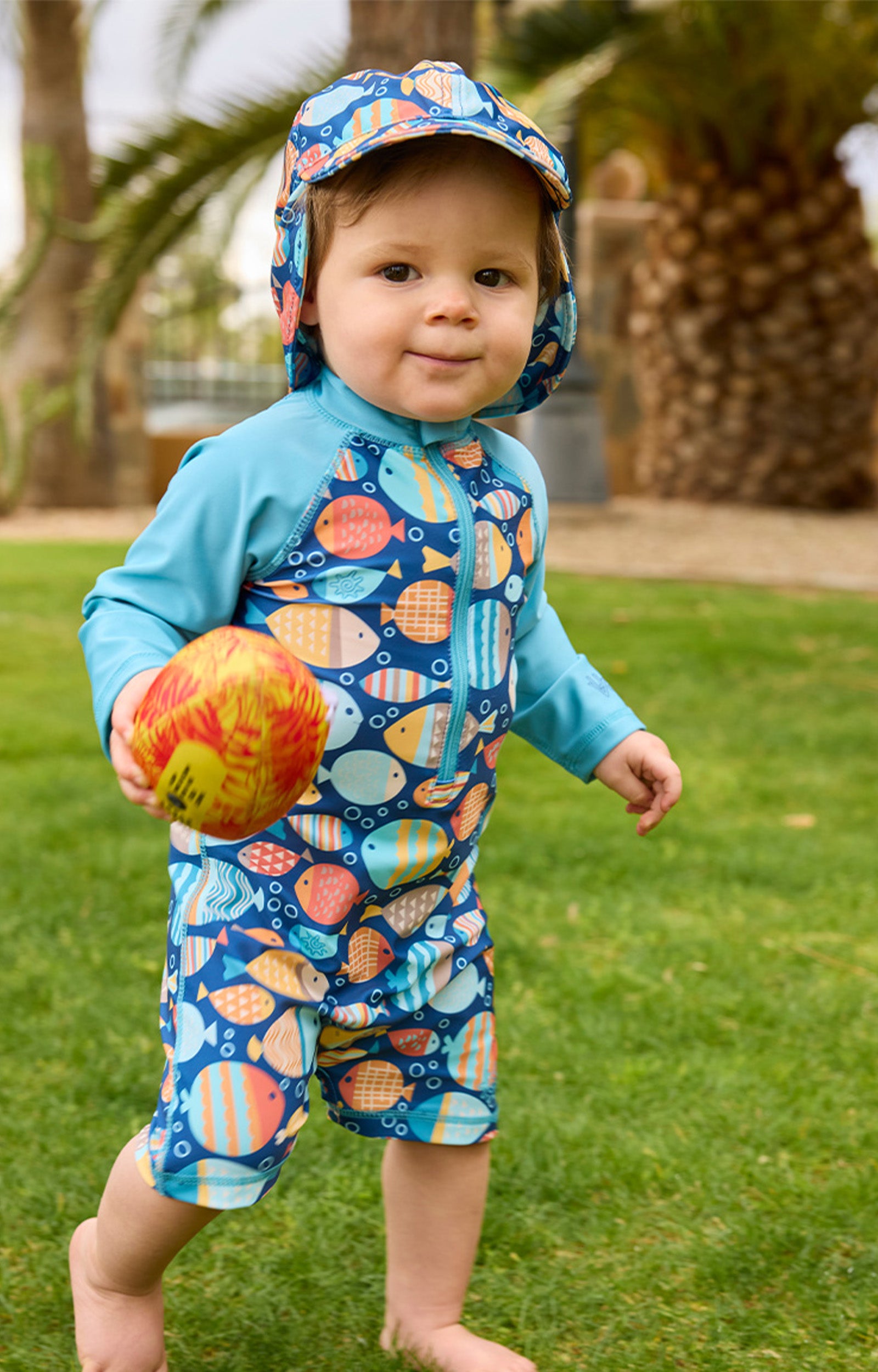 baby boy running in swim flap hat|fish-parade