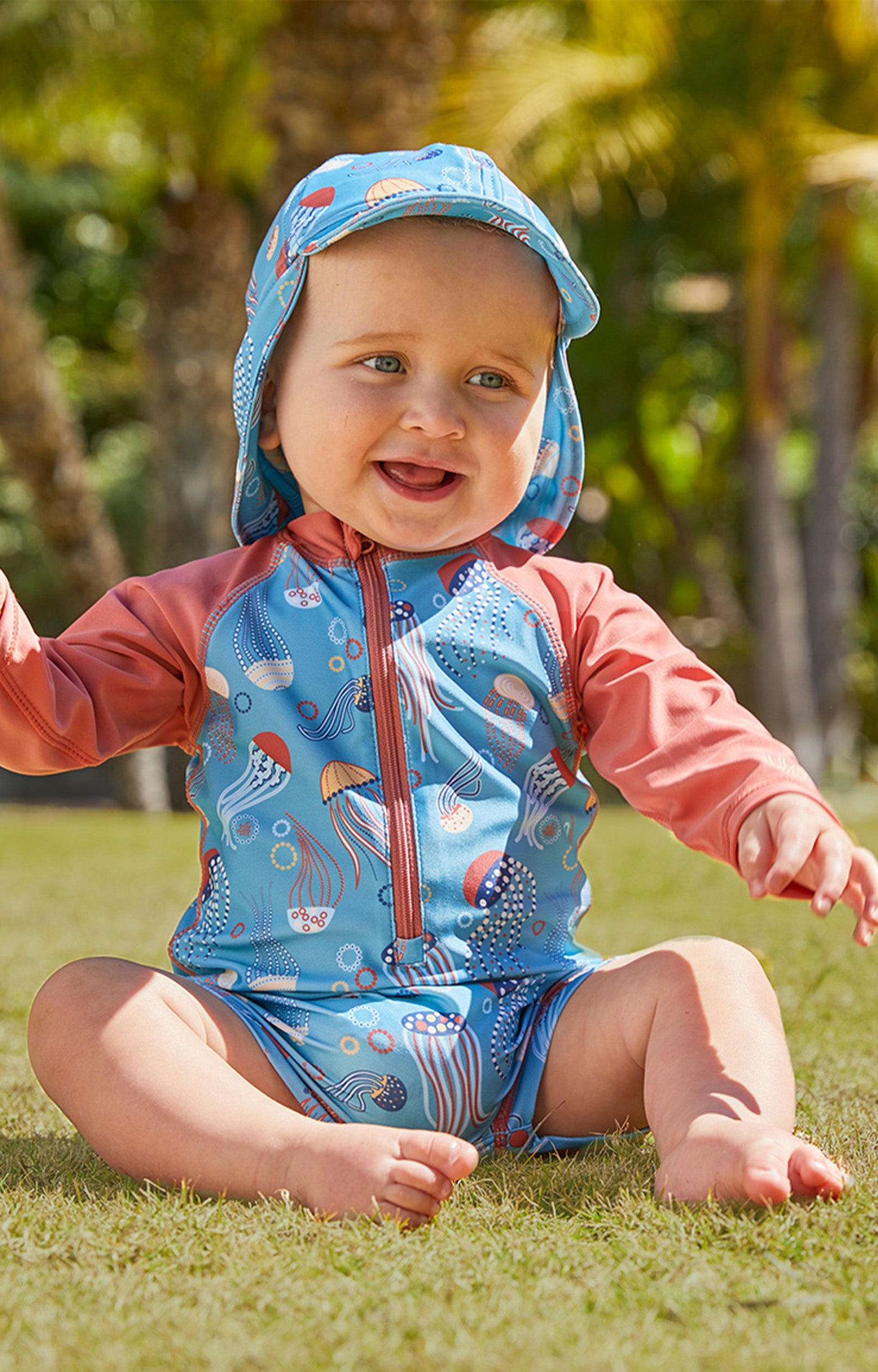 baby in UV Skinz's baby boy's swim flap hat|jolly-jellies