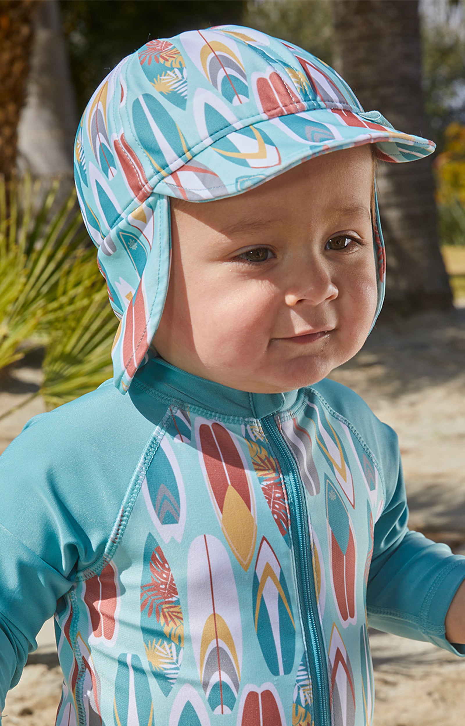 Little boy in UV Skinz's baby boy's swim flap hat with UPF 50+|surfs-up