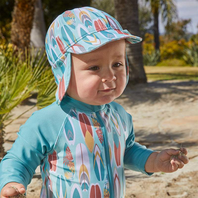 Little boy in UV Skinz's baby boy's swim flap hat with UPF 50+|surfs-up