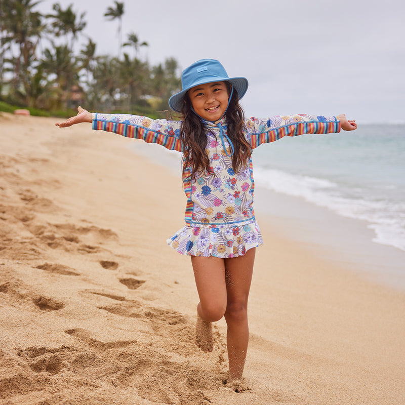 girl running on beach in 2pc long sleeve sunny swim set|summer-garden