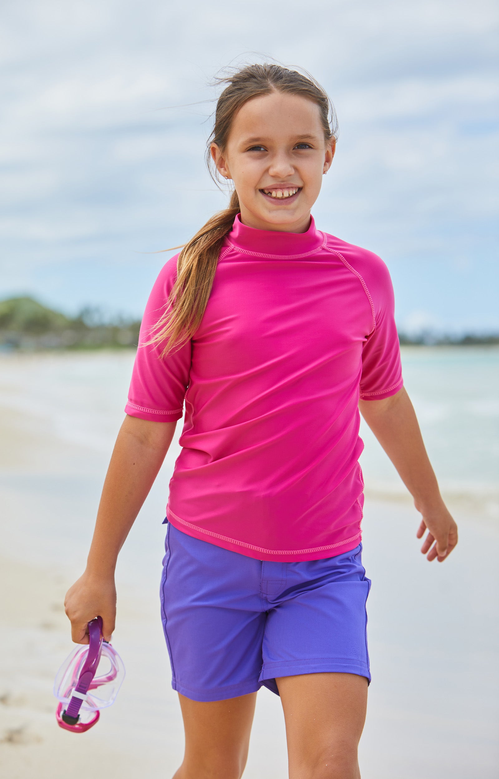 Girl in UV Skinz's purple board shorts|purple