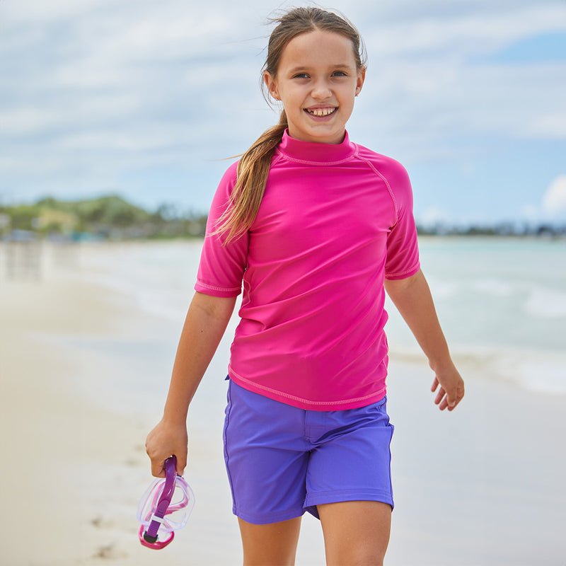 Girl in UV Skinz's purple board shorts|purple