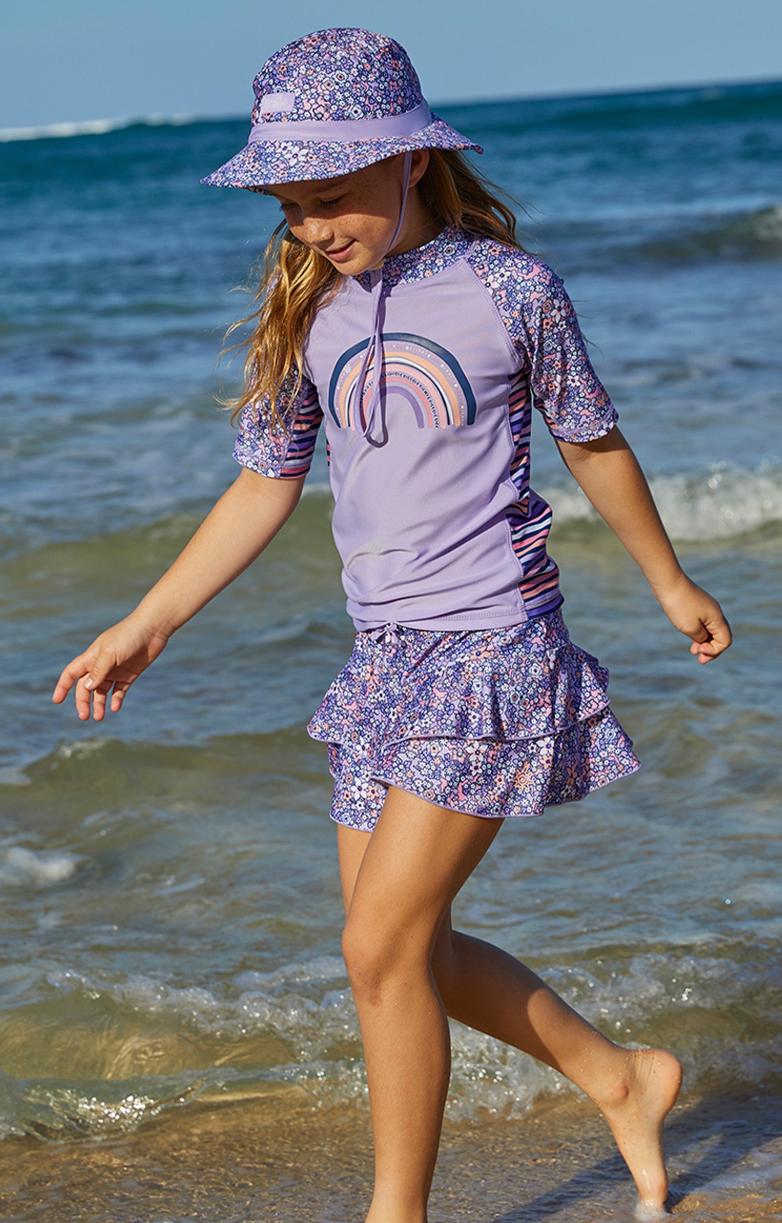 Girl wearing UV Skinz's girls swim skirt in lavender fields|lavender-fields