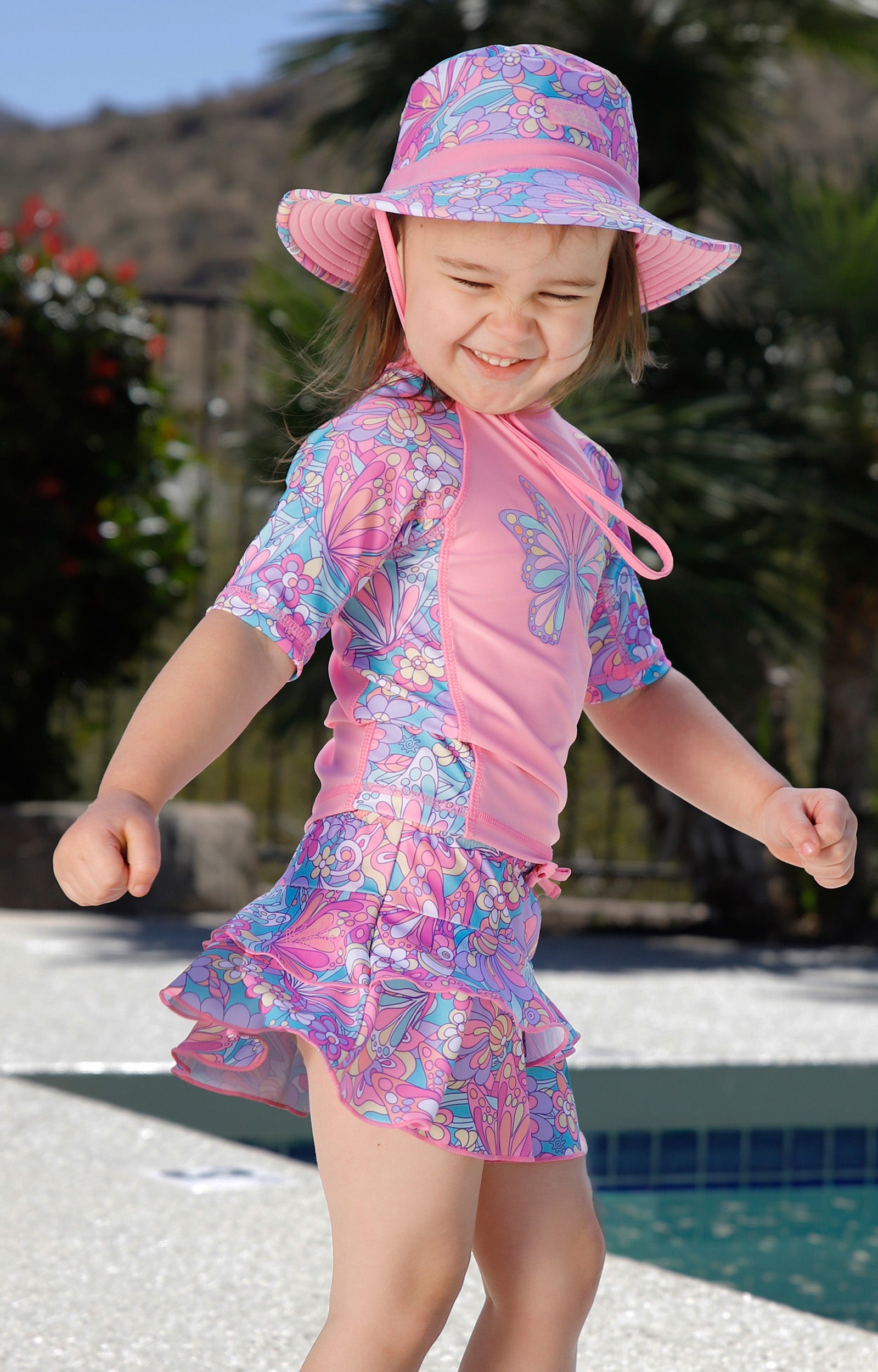 girl dancing in short sleeve sunny swim shirt|mosaic-butterflies