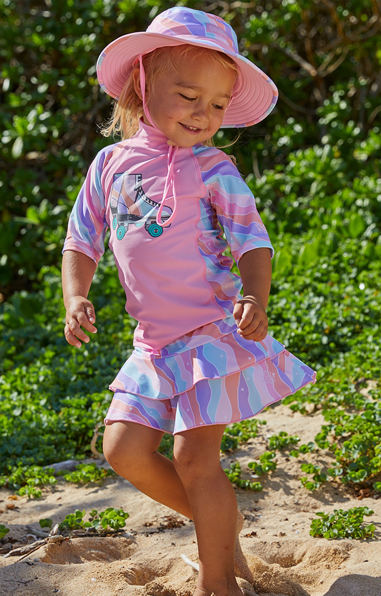 Girl in UV Skinz's girls swim skirt in rollin along|rollin-along
