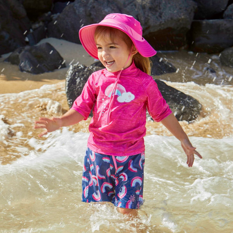 Little girl in UV Skinz's girl's short sleeve sport sun and swim shirt in hot pink jaspe rainbow|hot-pink-jaspe-rainbow