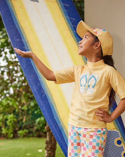 girl in snap back hat|marigold-checkered-daisies