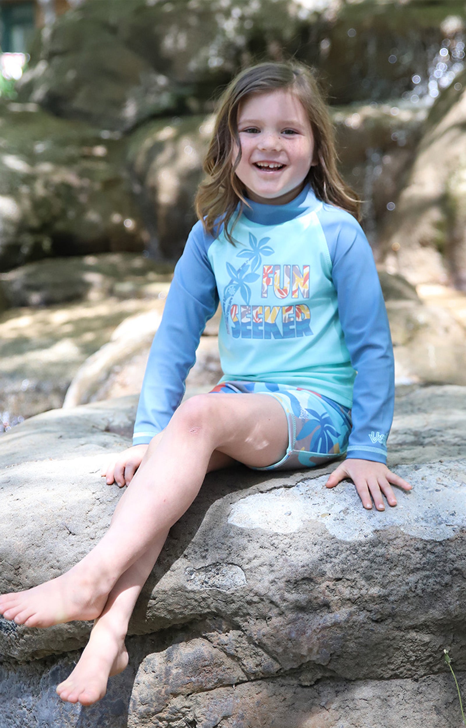 girl on rock in kids long sleeve sun & Swim shirt|fun-seeker