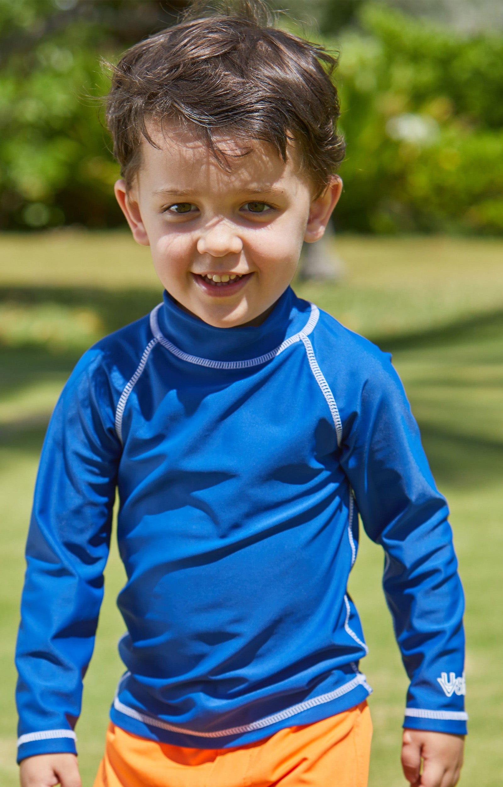 Little boy in the kid's long sleeve swim shirt in navy|navy