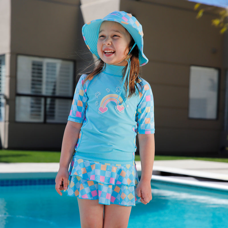 girl by pool in girls swim hat|treasure-checkers
