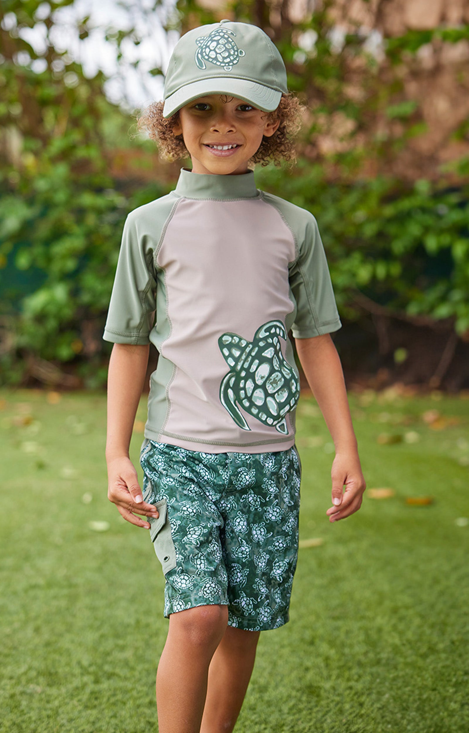 boy in racer stripe board shorts|turtle-cove