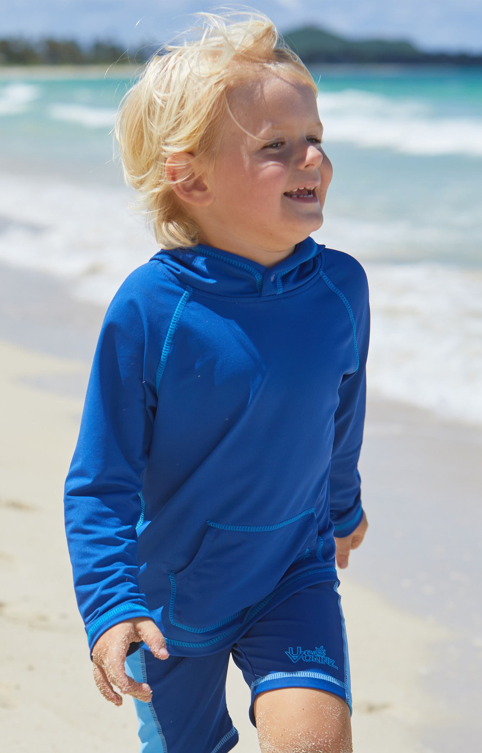 Little boy in UV Skinz's boy's pullover hoodie in navy|navy
