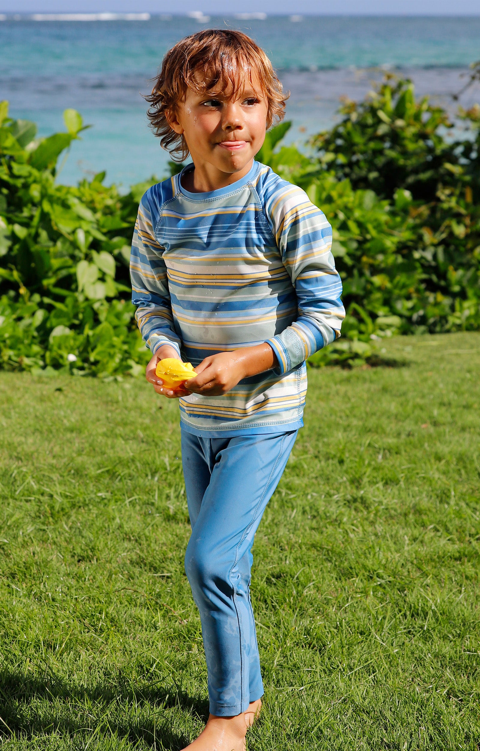 boy in grass in boy sun leggingz in baltic|baltic