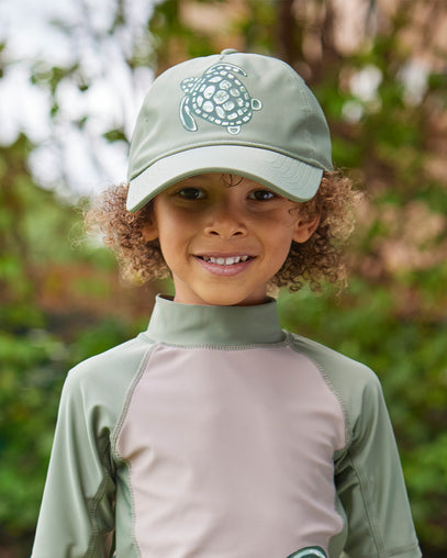 boy in snap back hat|washed-olive-coasting-turtle