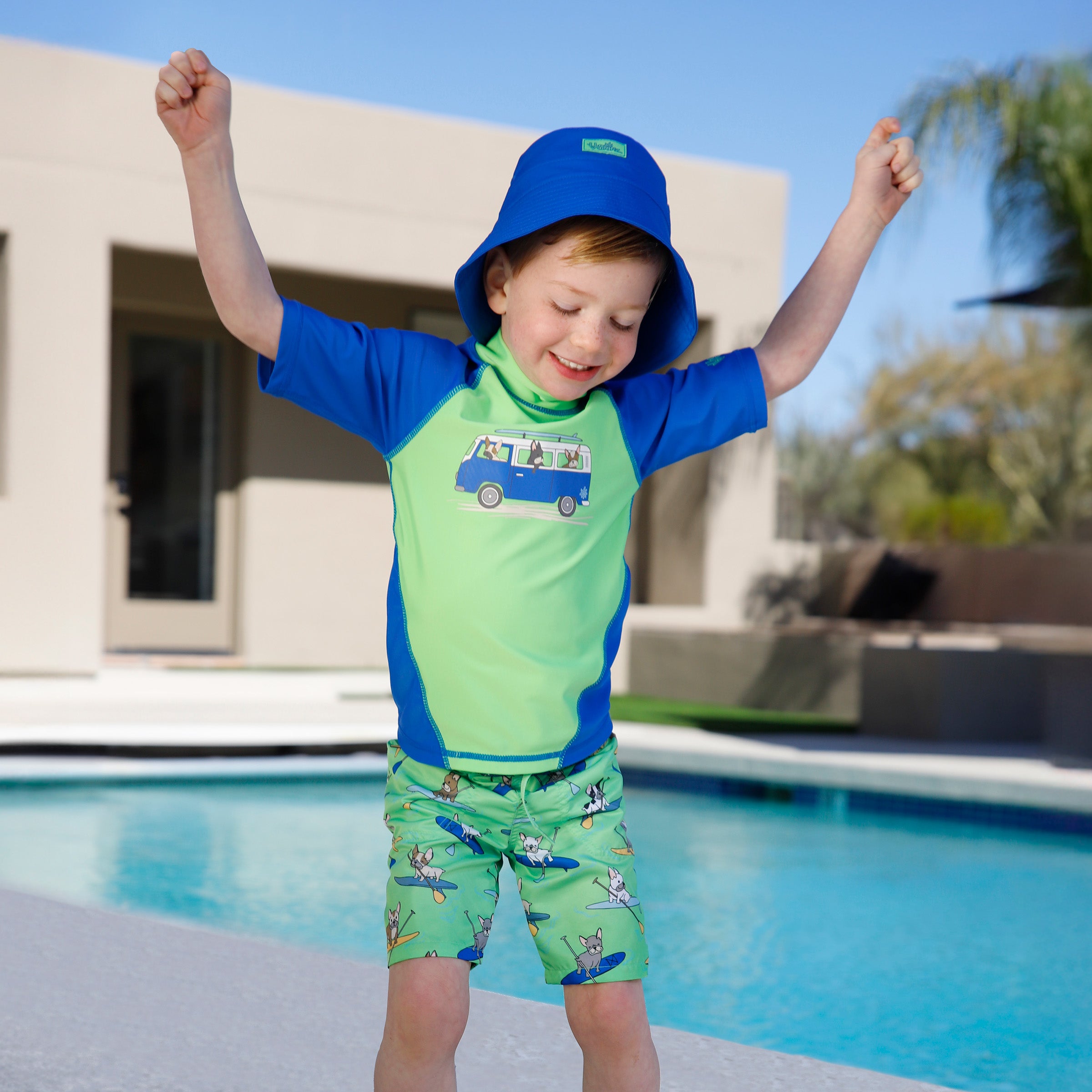 boy dancing by pool in boys short sleeve sun and swim shirt|beach-day
