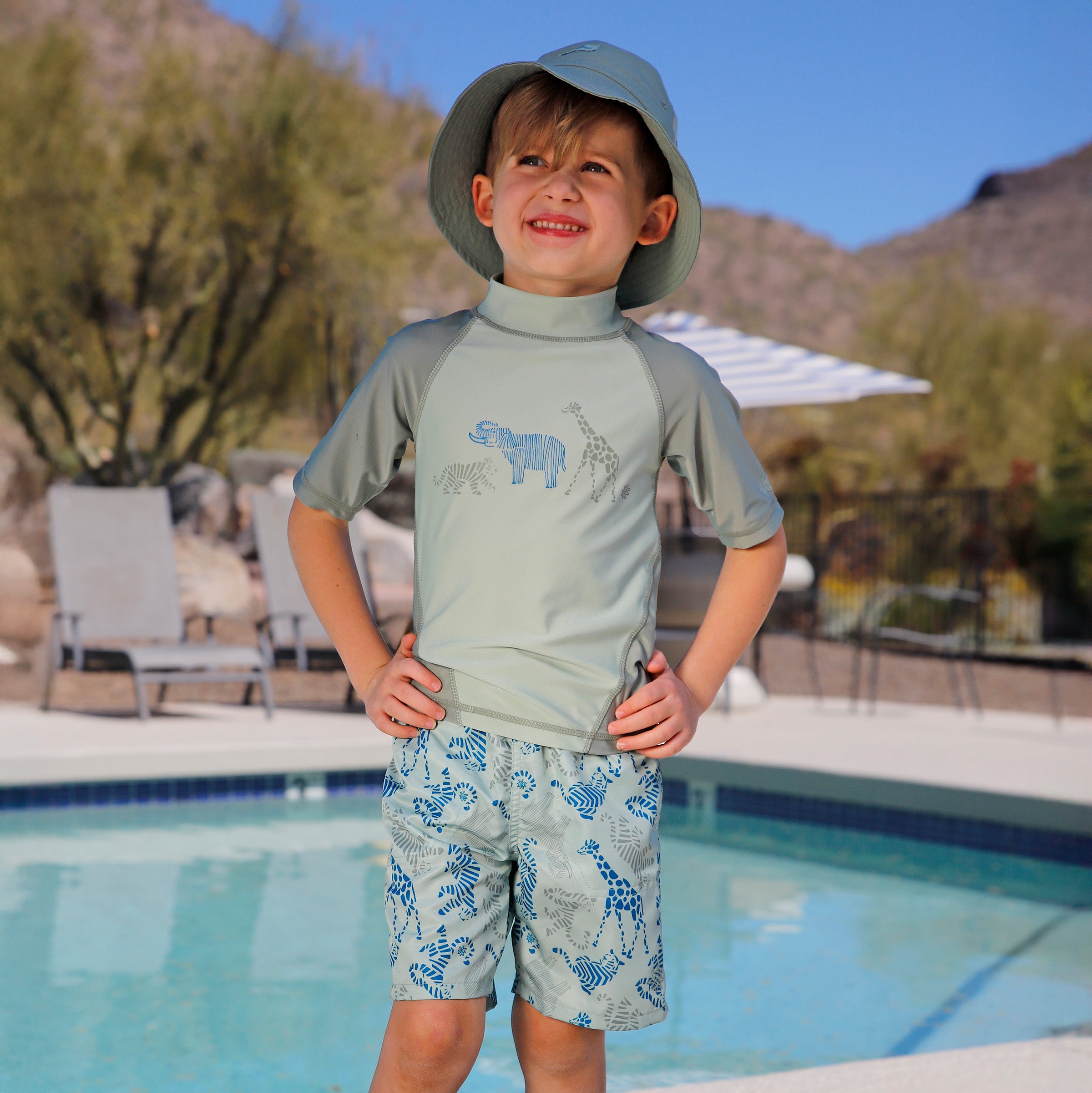 boy by the pool in boys short sleeve sun and swim shirt|zoo-parade