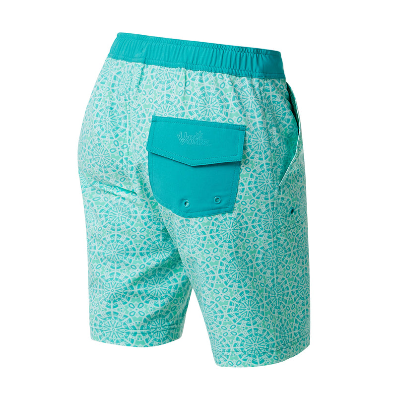 Pocket view of UV Skinz's women's board shorts in teal kaleidoscope|teal-kaleidoscope