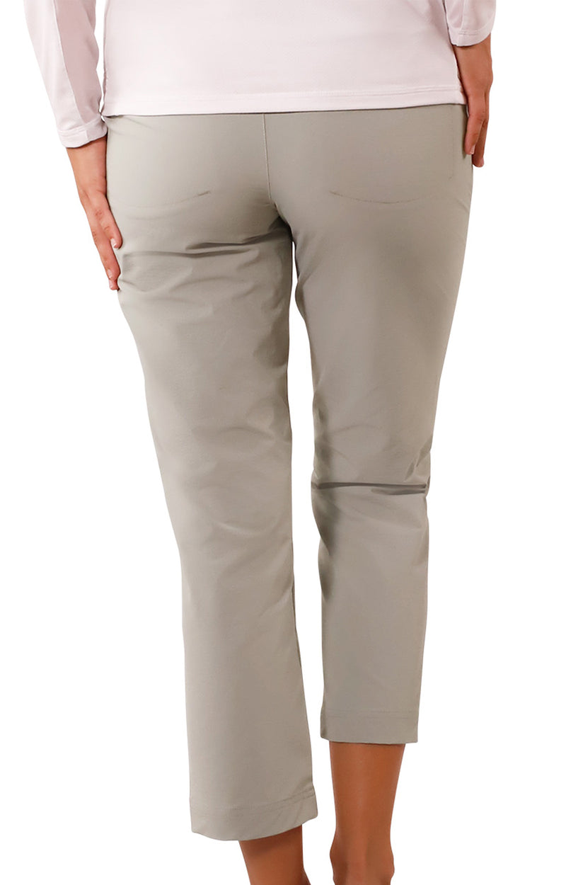 back view of woman in walking capris in agave|agave