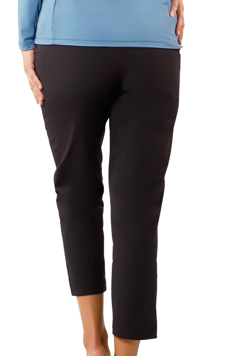 back view of woman in walking capris in black|black