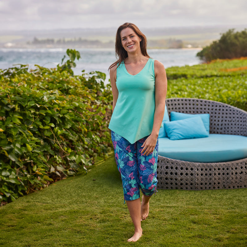 woman walking in wild rose tropics beach capris|wild-rose-tropics