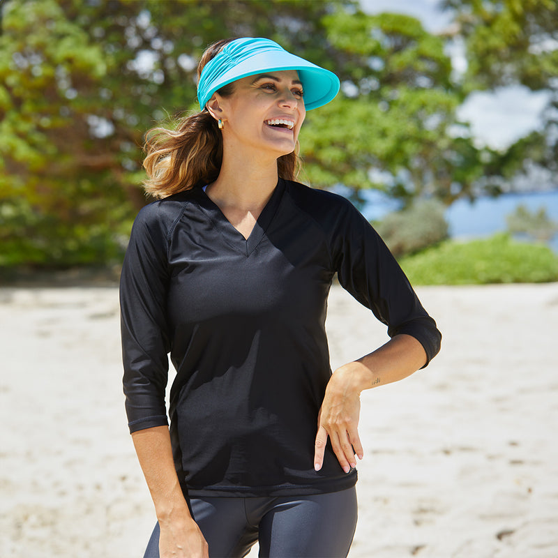 Woman in UV Skinz's Women's V-Neck Sun & Swim Shirt in Black|black