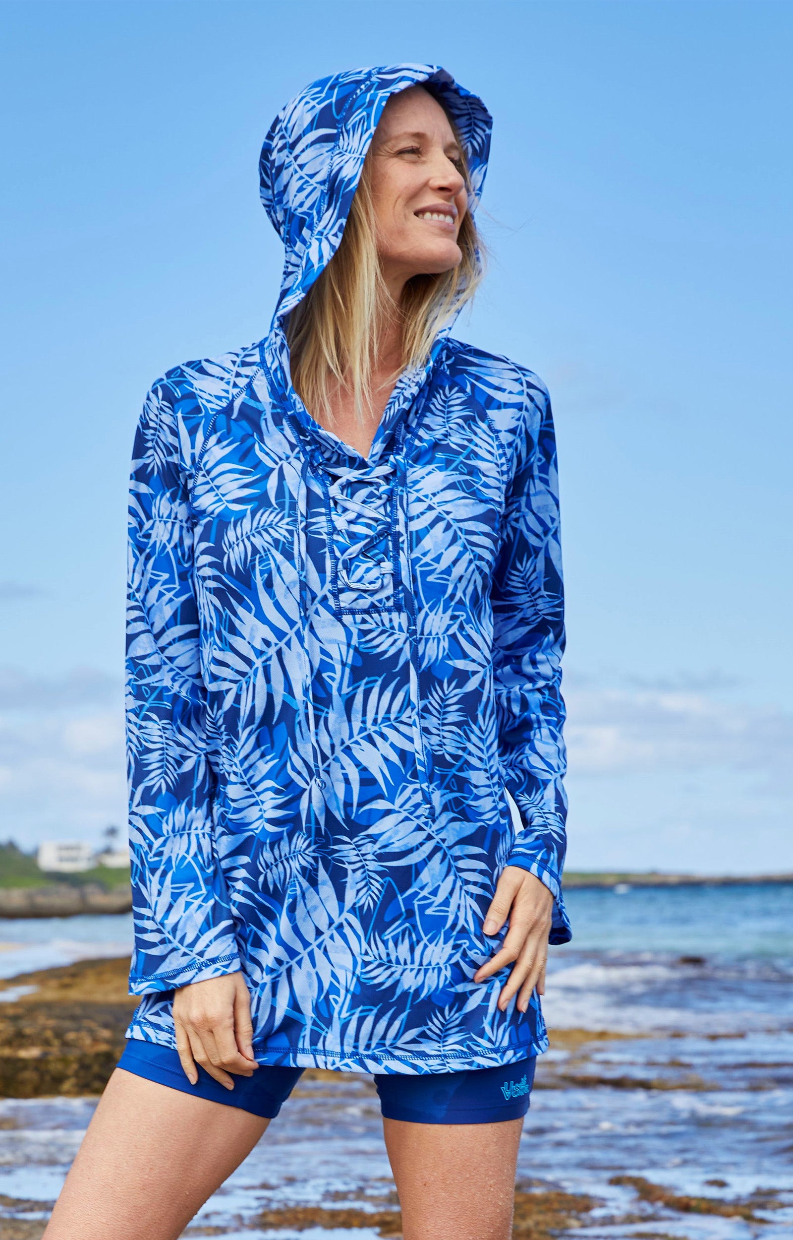 Woman on the Beach in the Women's Hooded Beach Cover Up in Navy Blue Palms|navy-blue-palms