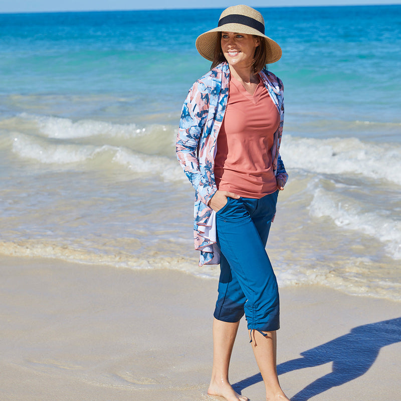 Woman in UV Skinz's women's hooded beach cover up in canyon watercolor|canyon-watercolor