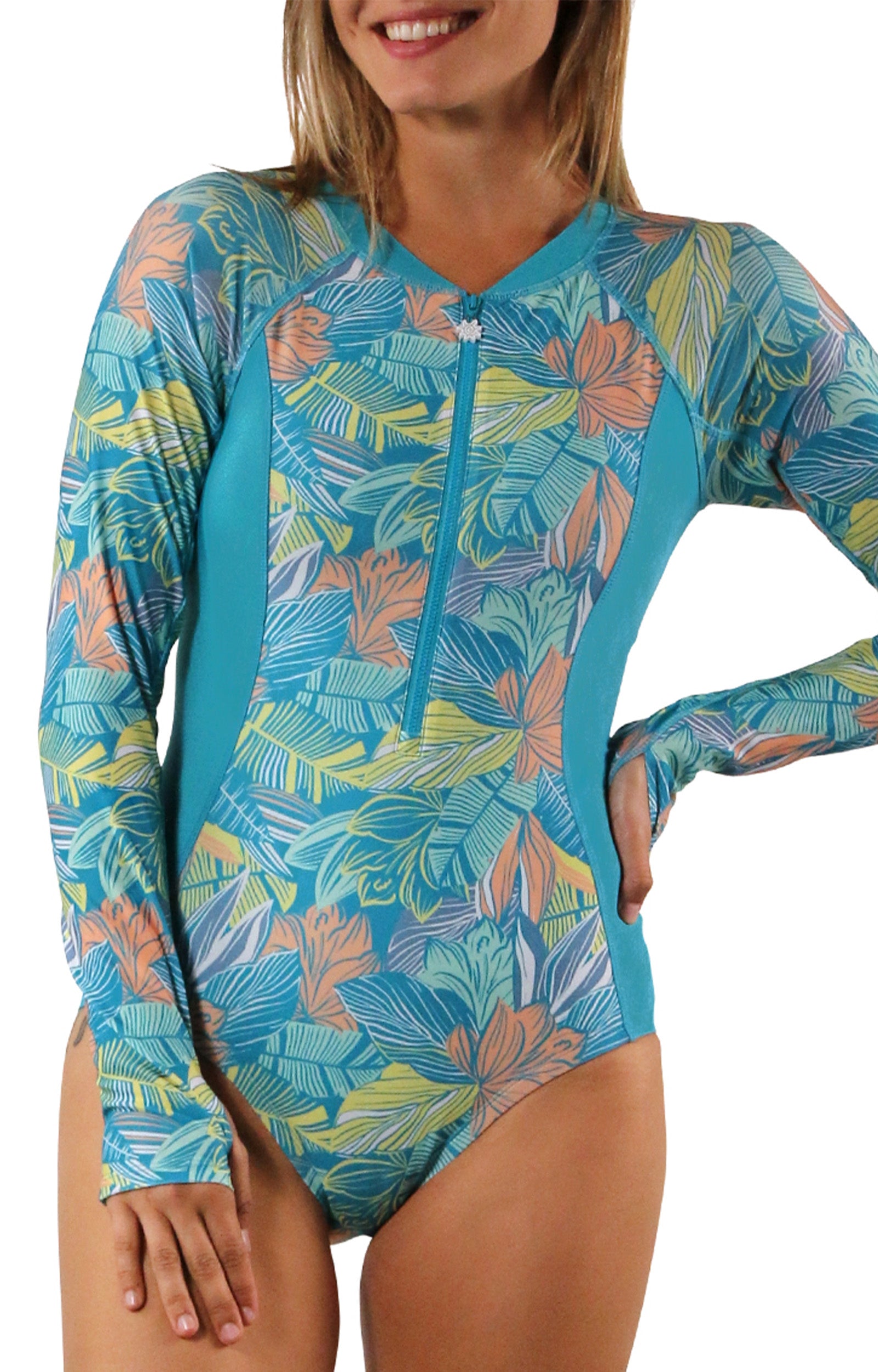 woman on sand on beach in long sleeve half zip swimsuit|caribbean-tropics