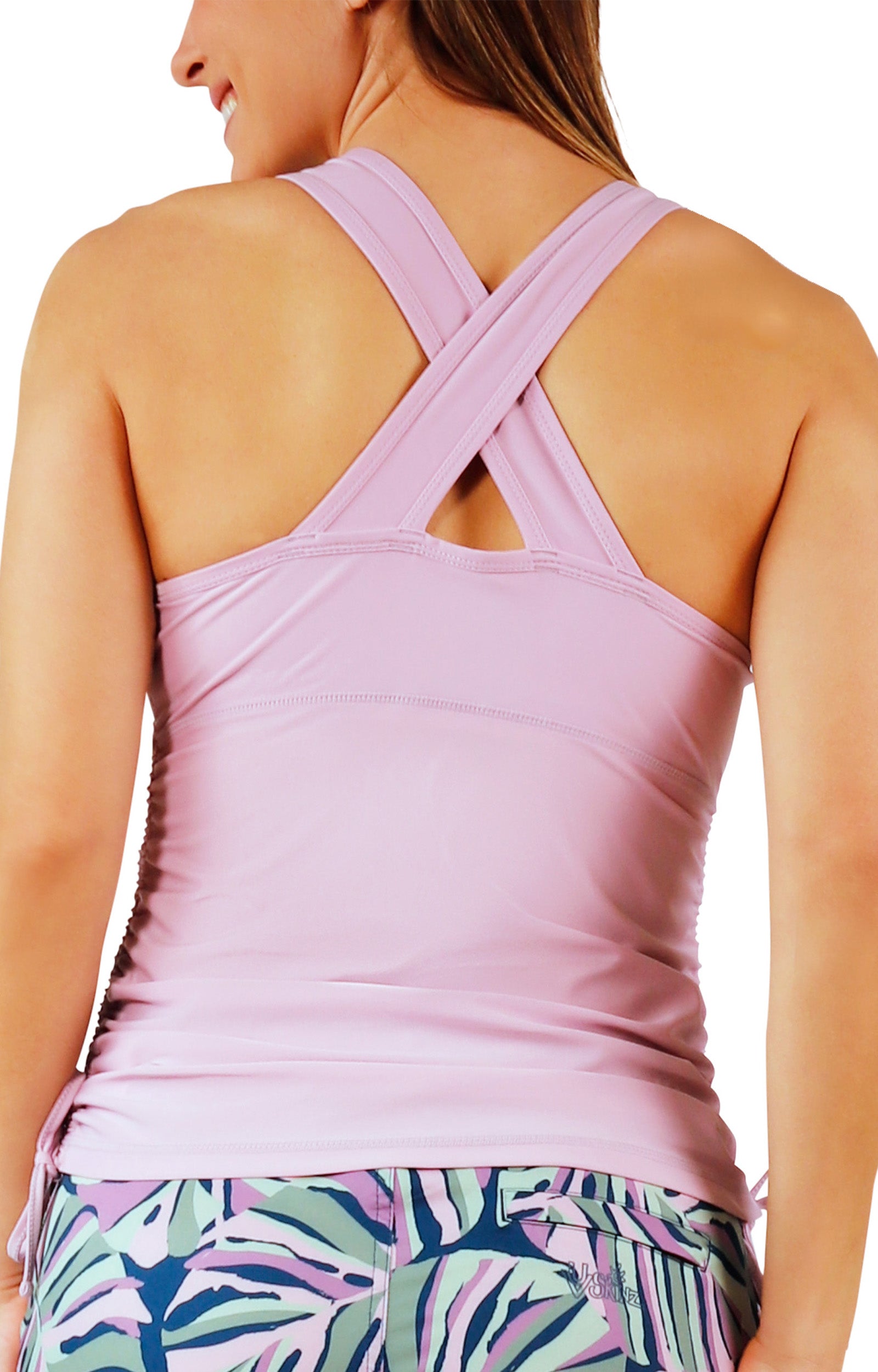 back view of woman in women's ruched scoop tank top in lotus|lotus