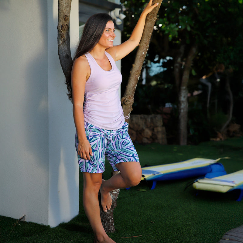 woman posing in women's ruched scoop tank top in lotus|lotus