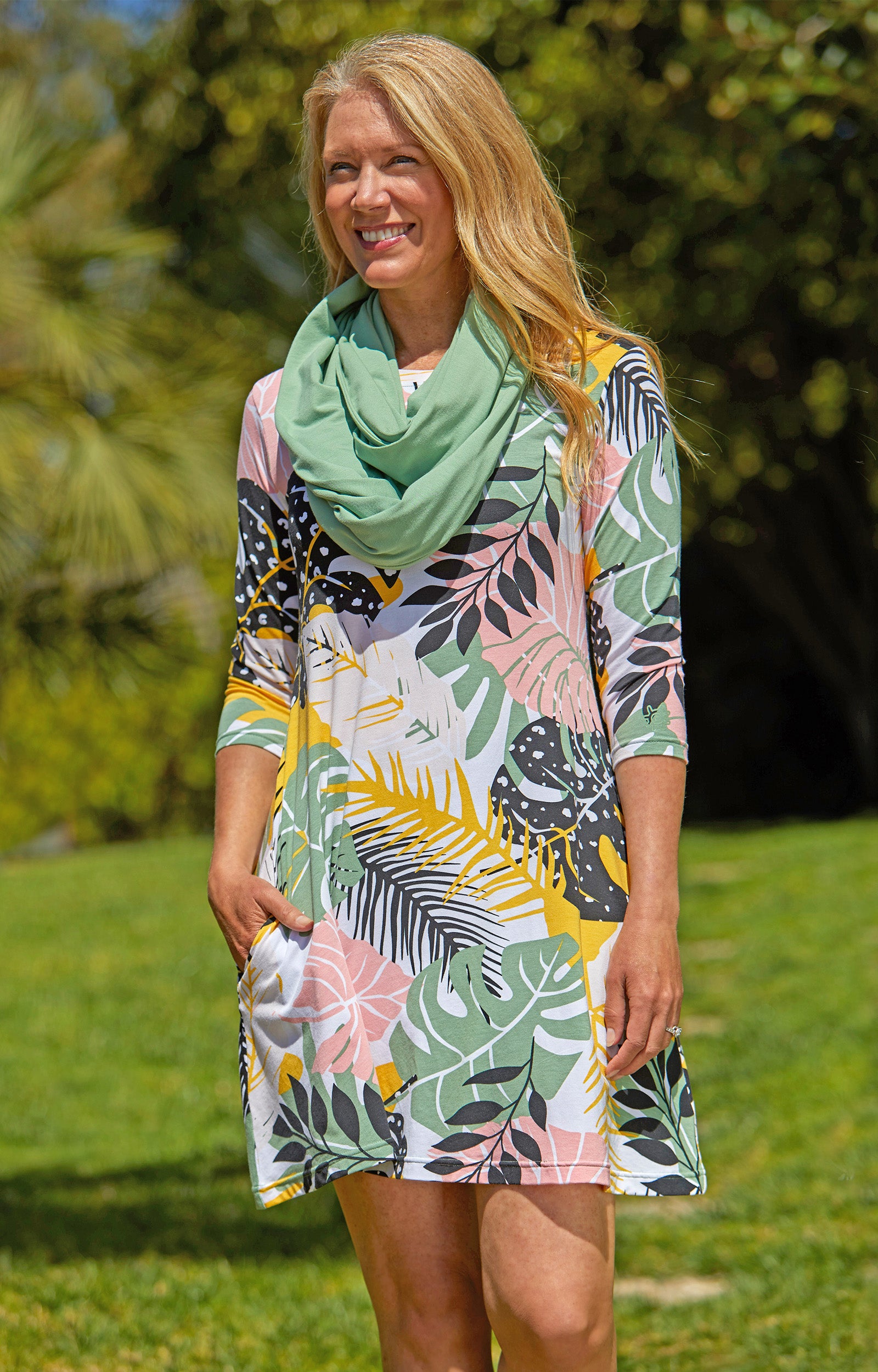 Woman in UV Skinz's Women's 3/4 Sleeve Swing Dress in Mykonos Blue|mykonos-blue