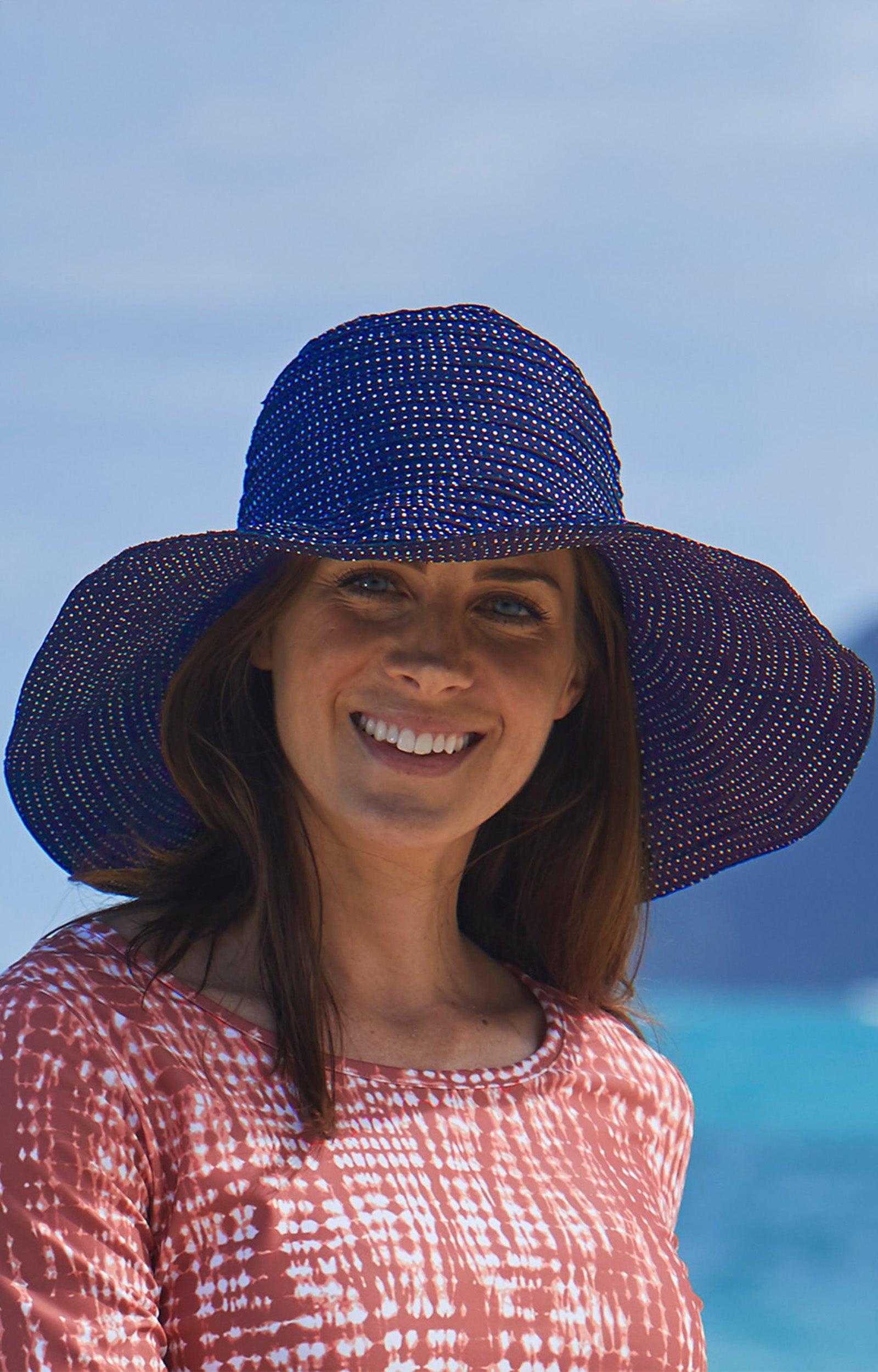 Woman in UV Skinz's wide brim UP 50+ hat|navy