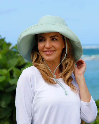 woman in women's roll up hat in dewdrop|dewdrop